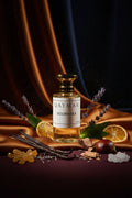 Small bottle labeled 'QAYMAR Golden Silk' on a dark textured surface