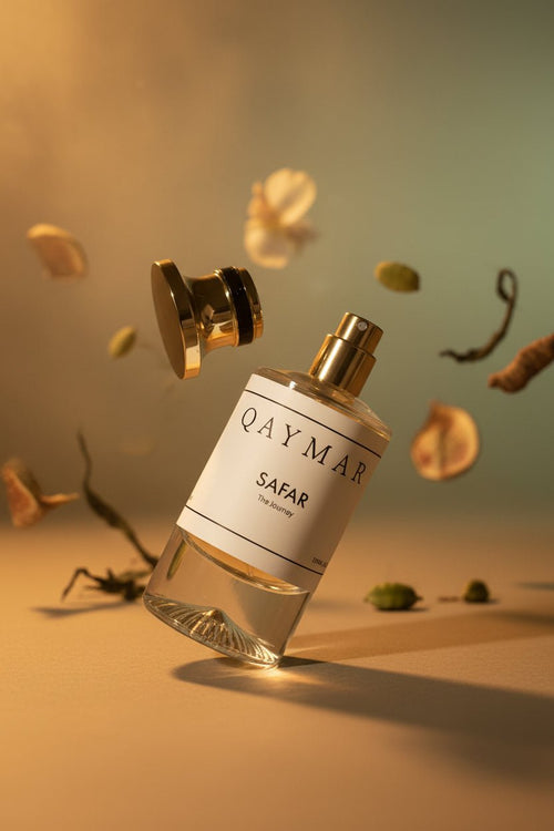 Qaymar Safar perfume bottle with a warm velvet journey, scent profile of smoky spicy wood and cardamom
